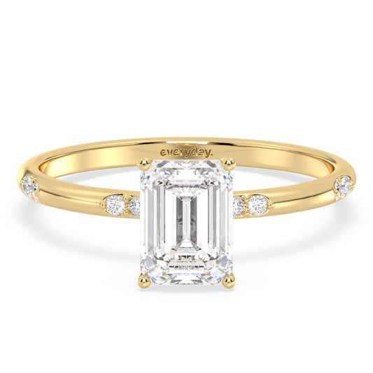 KATE EMERALD CUT SOLITAIRE RING WITH A STUDDED SHANK, GOLD