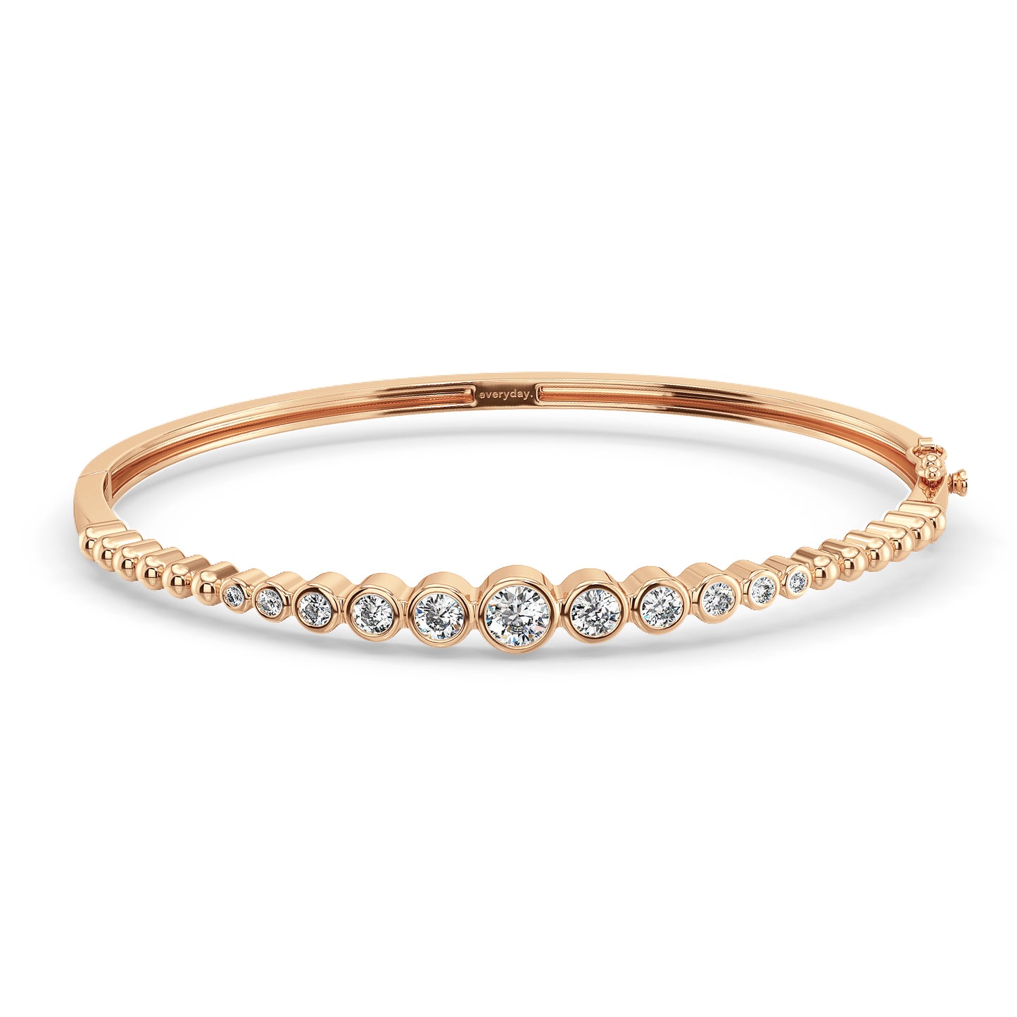 CLARETTE BEZEL SET ROUND CUT DIAMONDS OVAL BANGLE, GOLD