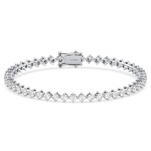 THEODORA DIAGONALLY SET PRINCESS CUT TENNIS BRACELET, GOLD