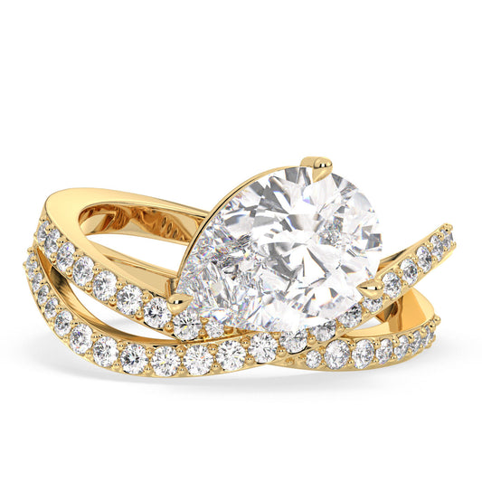 MARGUERITE PEAR CUT SOLITAIRE RING WITH A WAVY STUDDED SHANK, GOLD